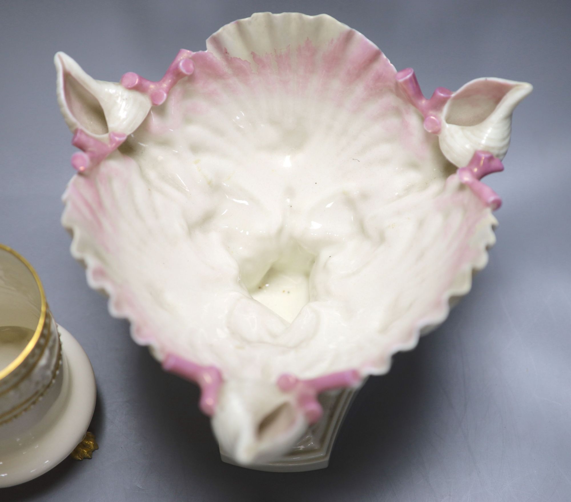 A Royal Worcester ewer, in the Persian style, a shell and dolphin centrepiece and a vase, tallest 30cm